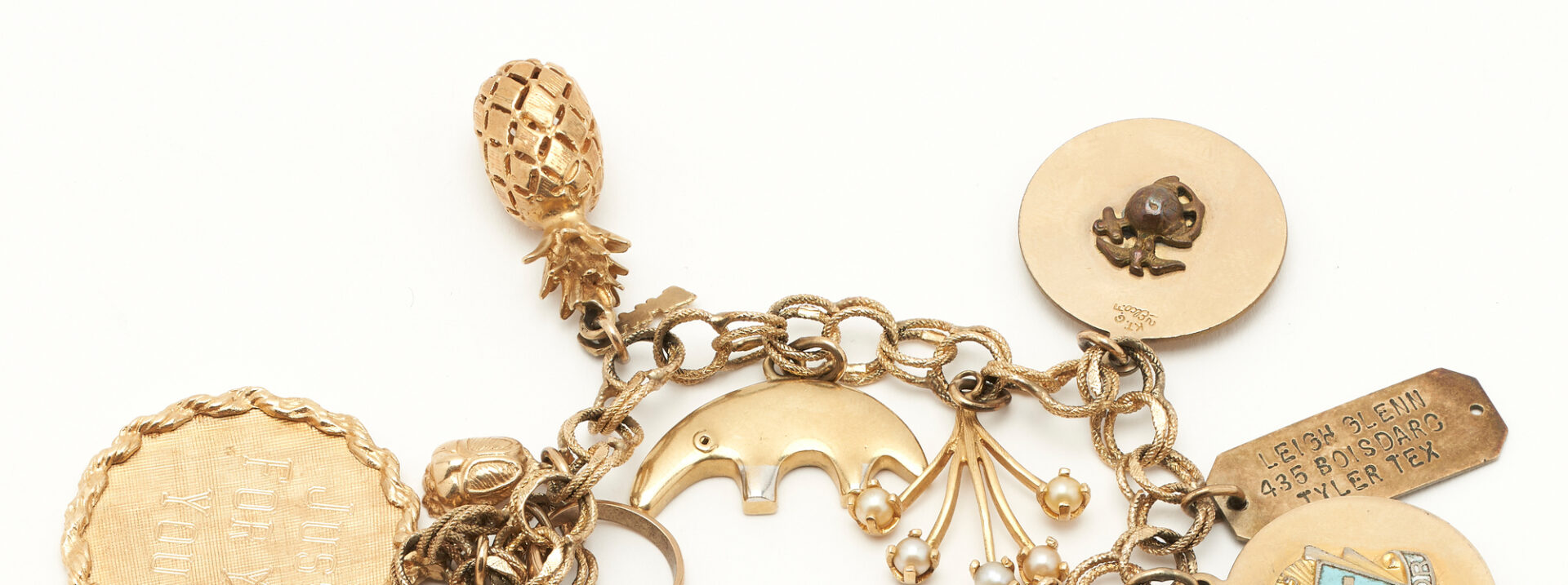 Lot 821: Yellow Gold Charm Bracelet & Charm Pendant