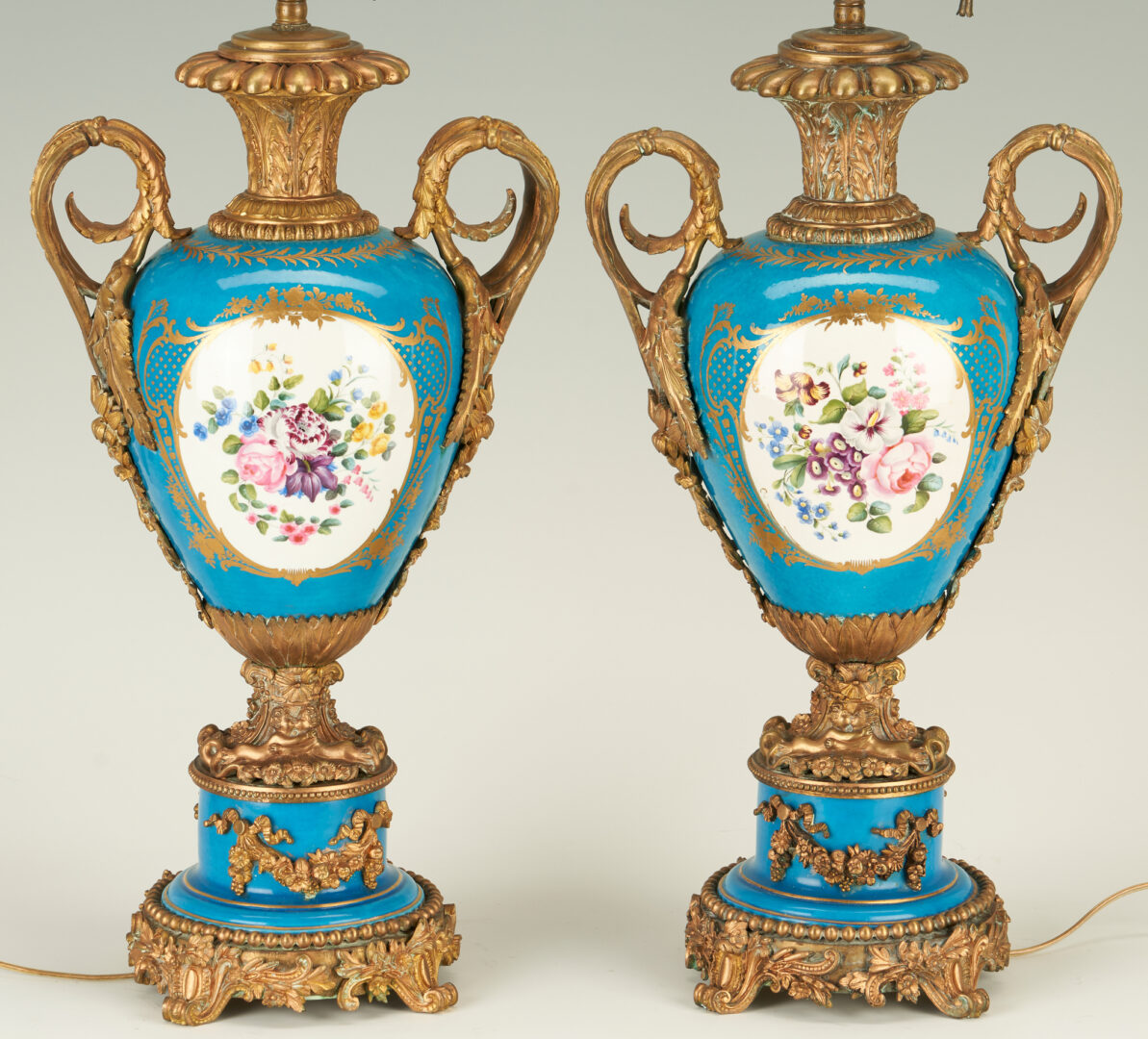 Lot 909: Pr. Sevres Style Bleu Celeste Porcelain Lamps, Ormolu mounts