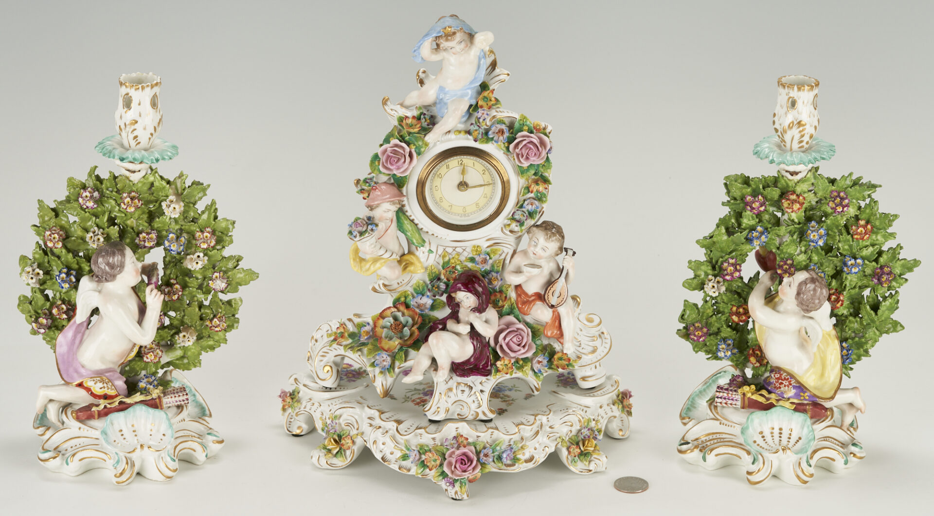 Lot 1002: Sitzendorf Porcelain Clock plus pair Chelsea Candlesticks