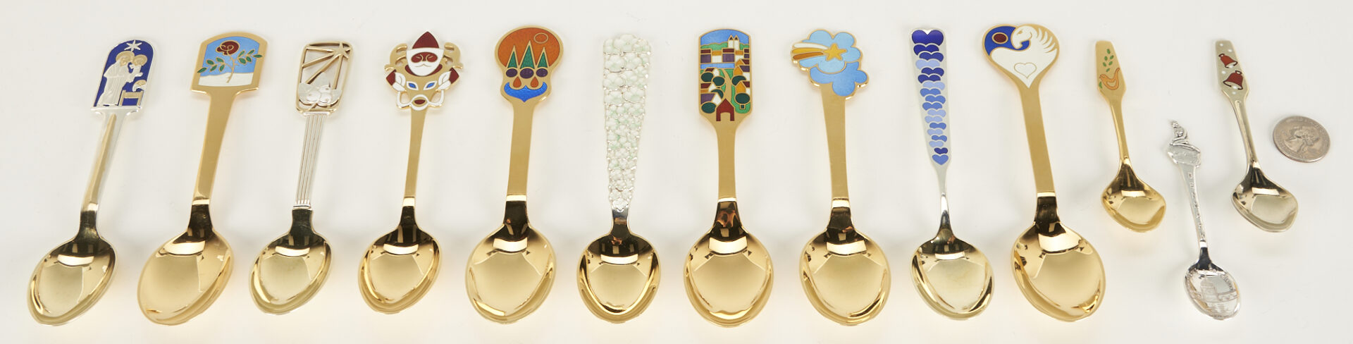 Lot 1107: 10 Michelsen Gilded Sterling Christmas Spoons, 1934-1988 plus 3 Assorted