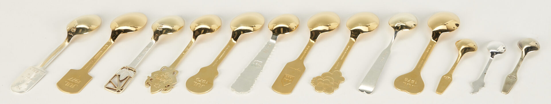 Lot 1107: 10 Michelsen Gilded Sterling Christmas Spoons, 1934-1988 plus 3 Assorted