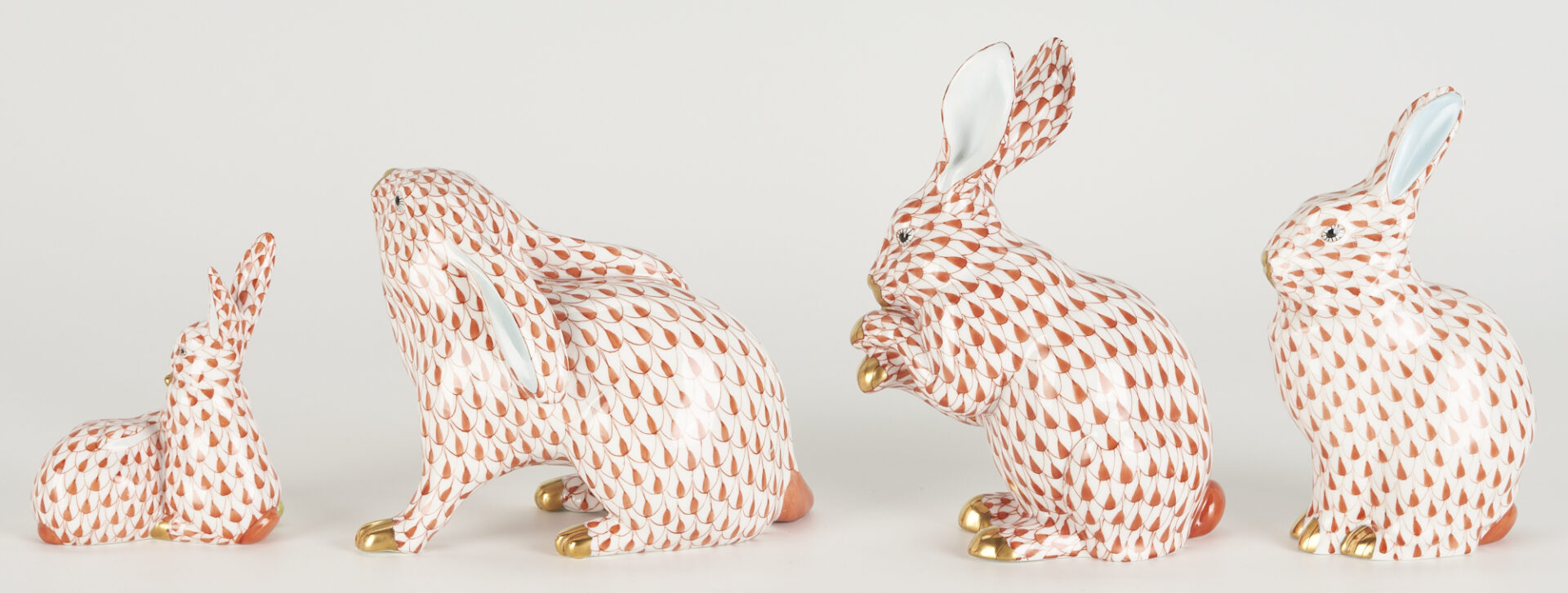Lot 283: 9 Herend Porcelain Rabbits, Red Fishnet Decoration