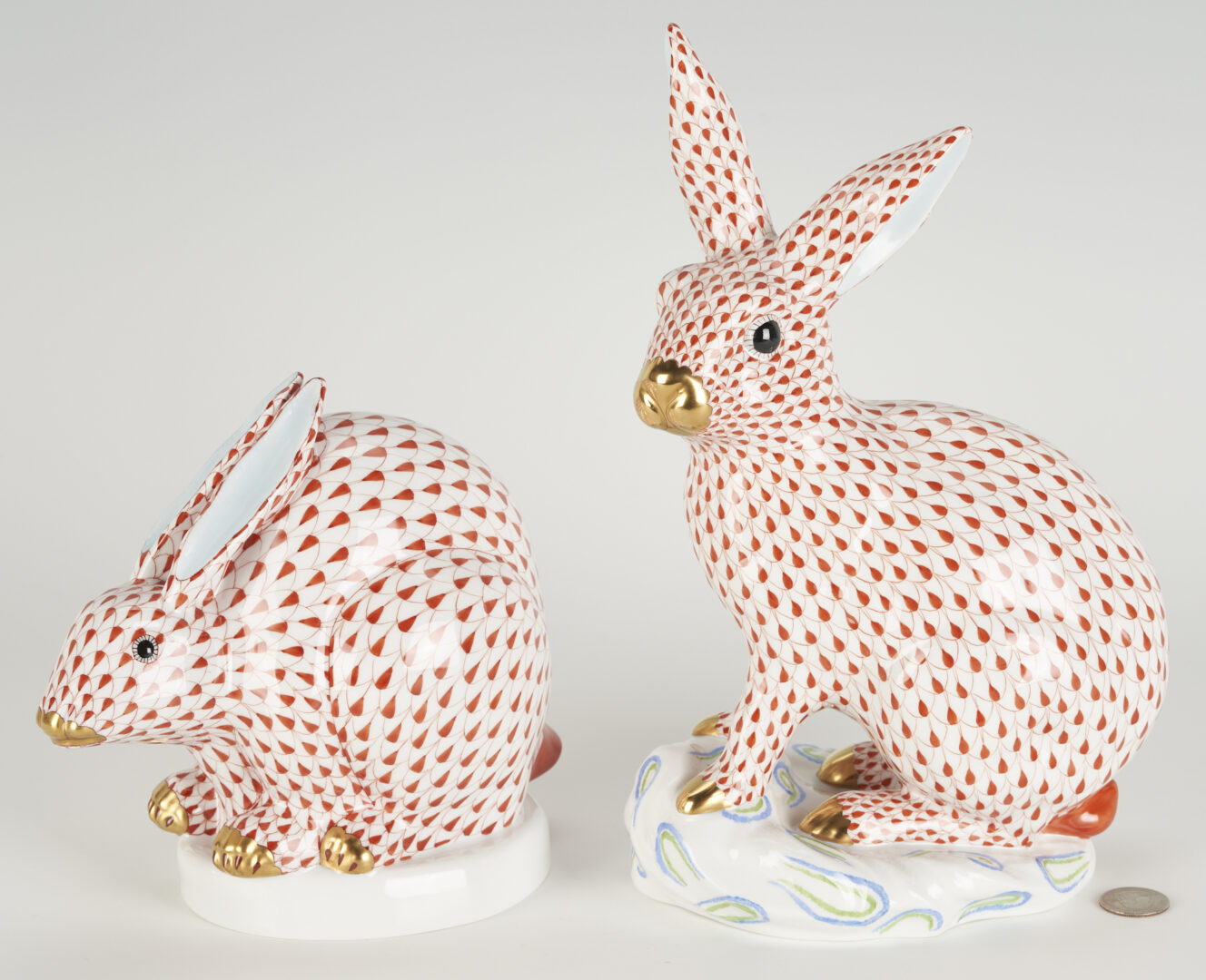Lot 285: 2 Large Herend Porcelain Rabbits, Red Fishnet Design