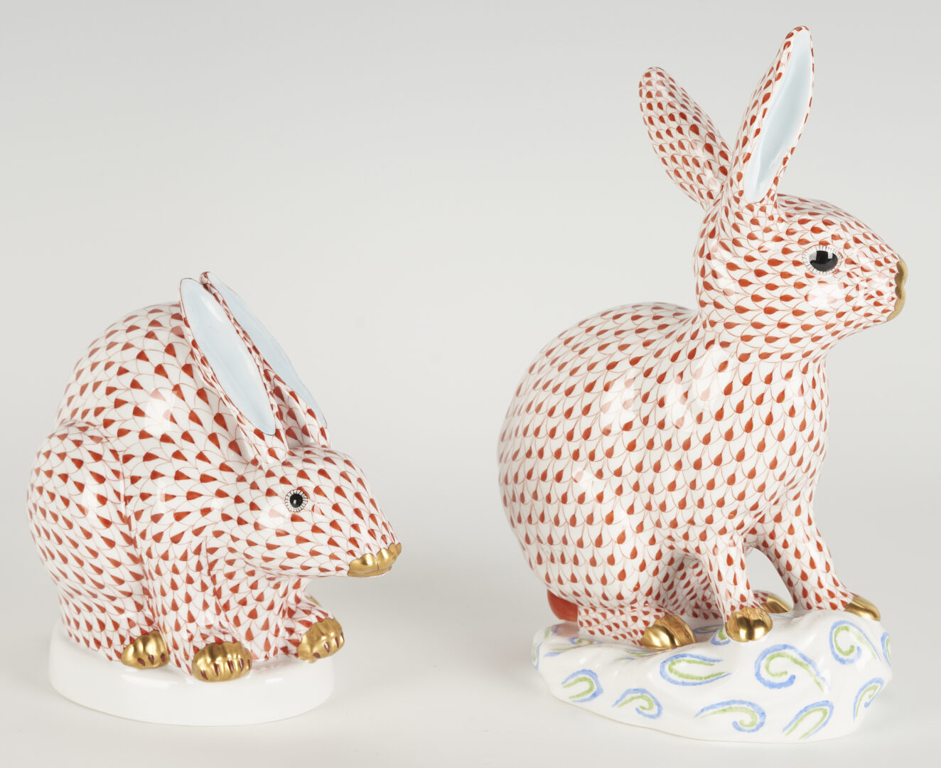 Lot 285: 2 Large Herend Porcelain Rabbits, Red Fishnet Design
