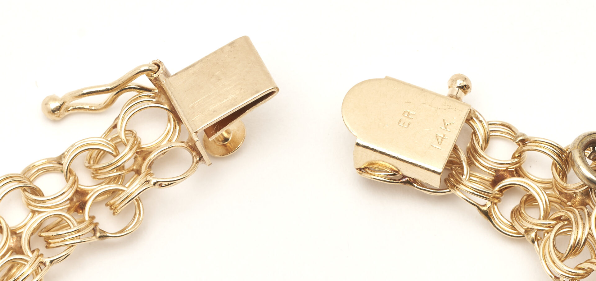 Lot 322: 14K Charm Bracelet w/ 8 Gold Charms
