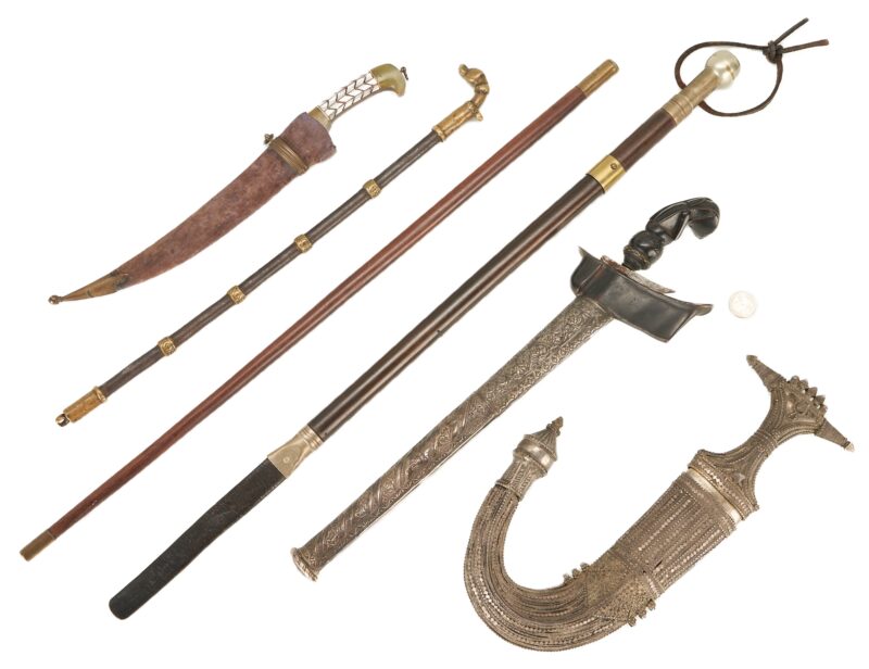 Lot 617: G. Bascalia Sword Cane, 3 Middle Eastern Daggers, & 2 Walking Sticks, 6 items