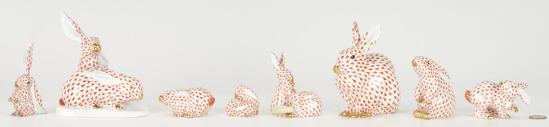 Lot 360: 8 Herend Porcelain Rabbits, Red Fishnet Decoration incl. Bunnies with Corn