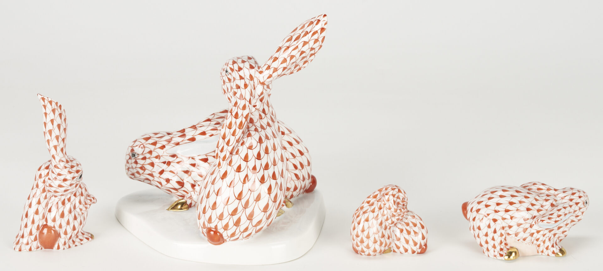 Lot 360: 8 Herend Porcelain Rabbits, Red Fishnet Decoration incl. Bunnies with Corn