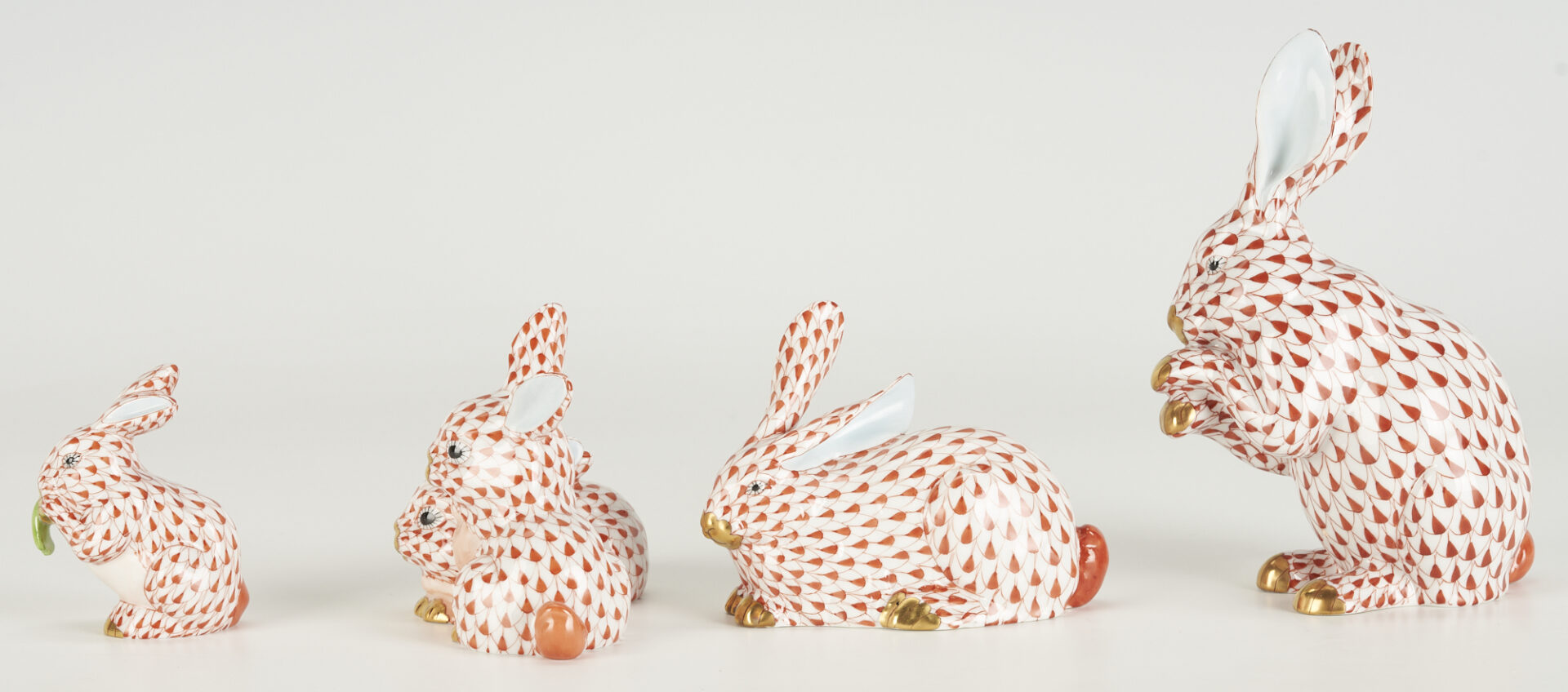 Lot 361: 8 Herend Porcelain Bunnies, Red Fishnet Decoration, incl. Bunny with Lettuce
