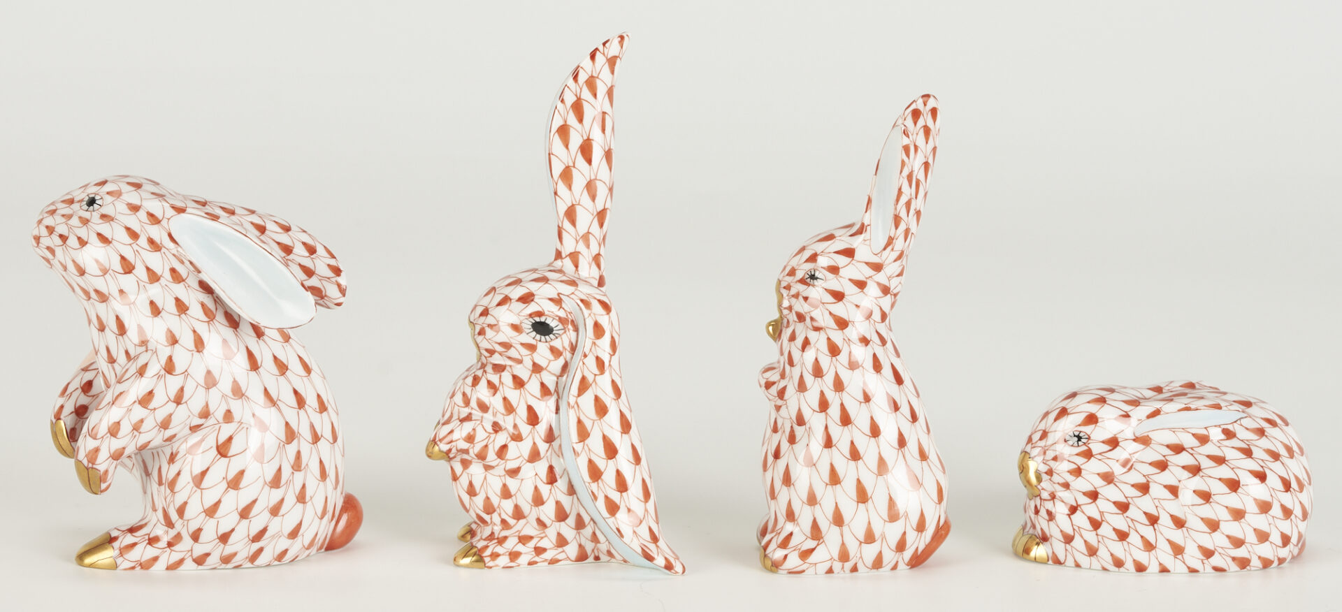 Lot 361: 8 Herend Porcelain Bunnies, Red Fishnet Decoration, incl. Bunny with Lettuce