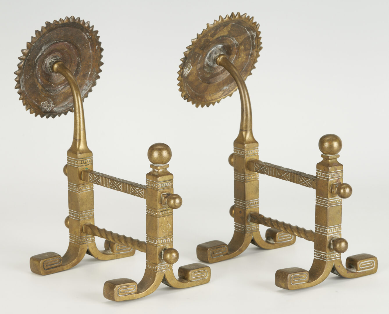 Lot 380: Pair of Aesthetic Movement Sunflower Brass Fire Dogs Tool Rests