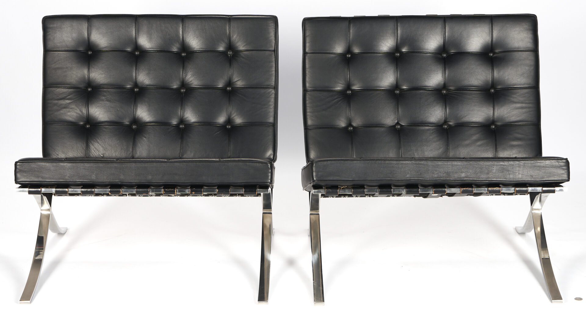 Lot 471: Pair 1960s Knoll Barcelona Black Leather Chairs, labeled