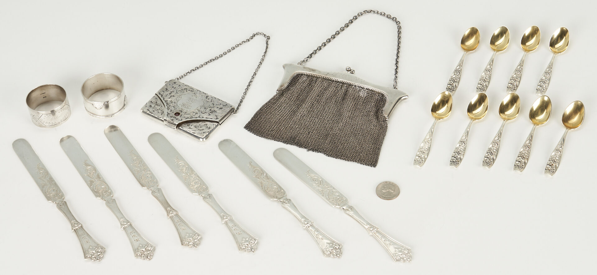 Lot 732: Assd. Sterling: 9 Shiebler spoons, 2 purses incl. Tiffany, 2 napkin rings, 6 Knives