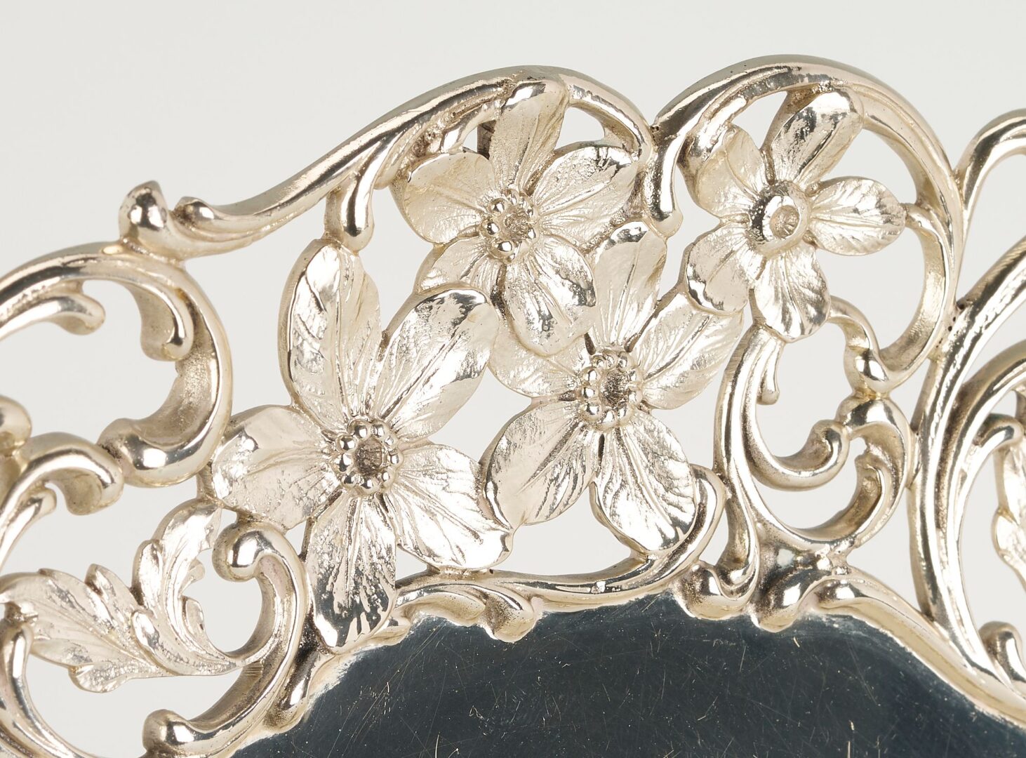 Lot 1055: 3 pcs. Sterling Hollowware, incl.  Floral Footed Plate