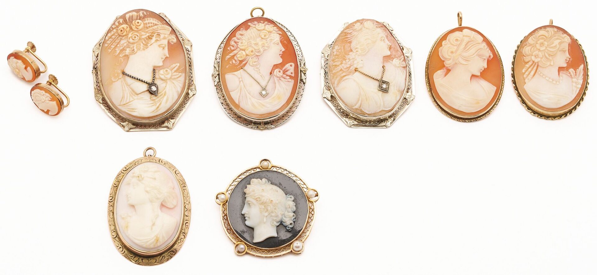 Lot 322: Seven (7) Gold Cameo Brooches & One (1) Pair Cameo Earrings
