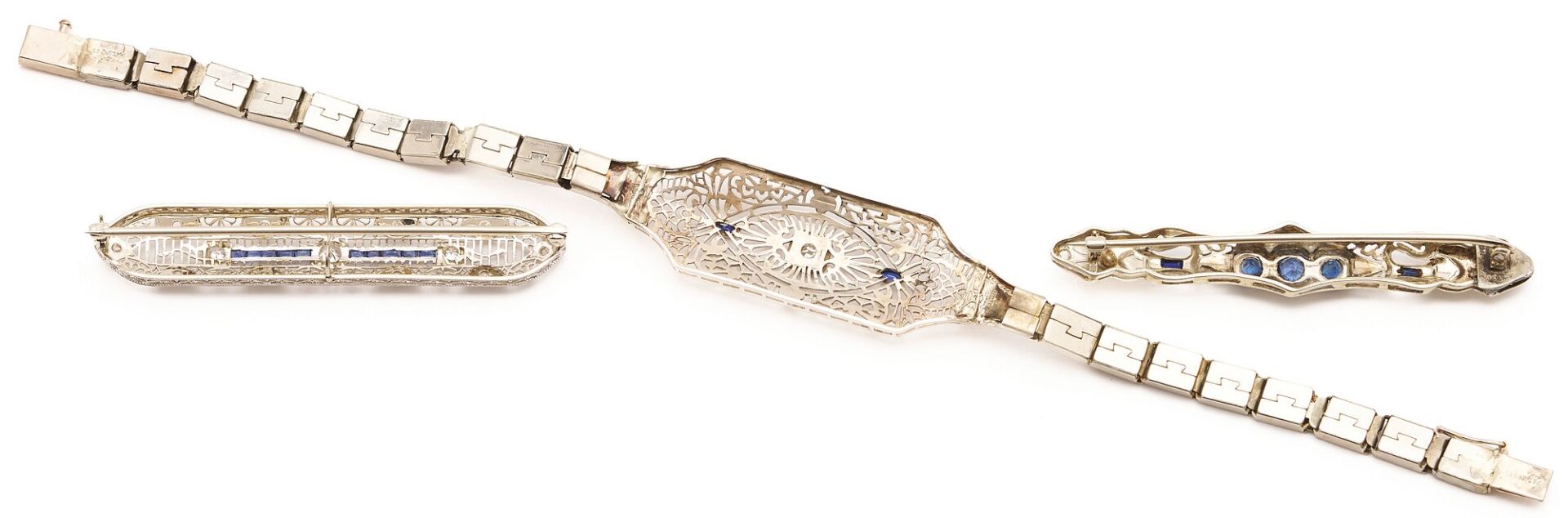 Lot 729: 14K White Gold Art Deco Bracelet and two (2) Brooches