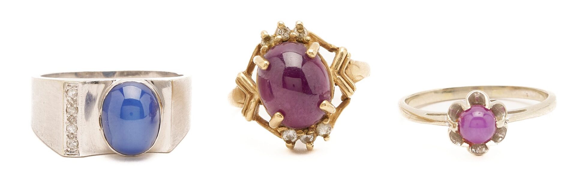 Lot 845: Two Gold & Cabochon Ruby Rings and one Gold & Sapphire Ring