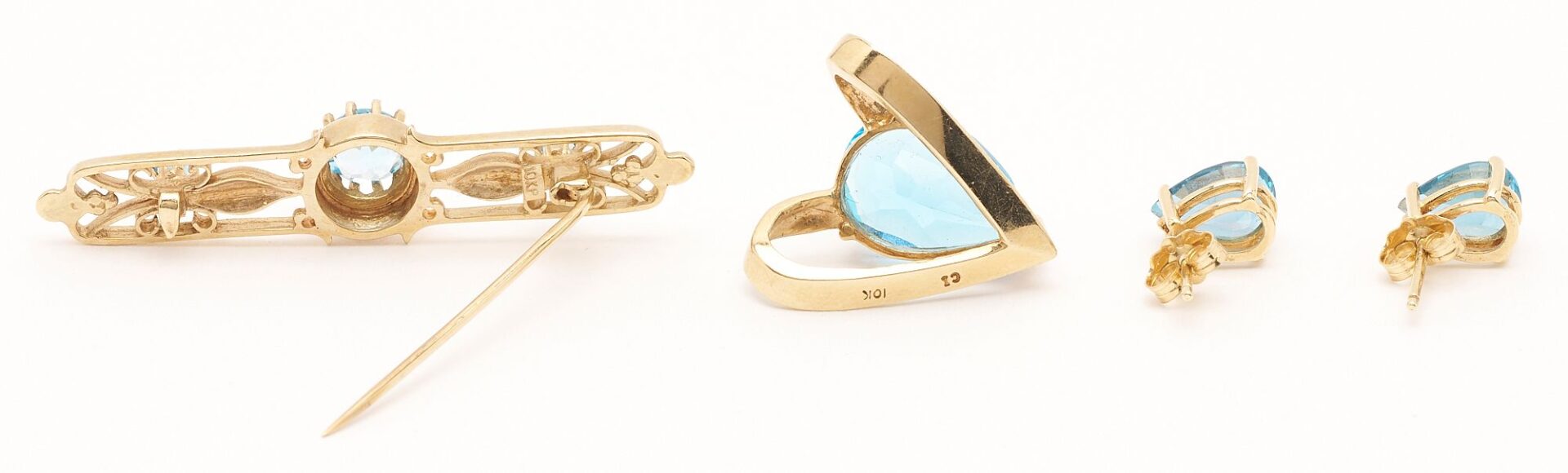 Lot 846: Gold & Blue Topaz Bracelet, Earrings, Brooch, and Pendant