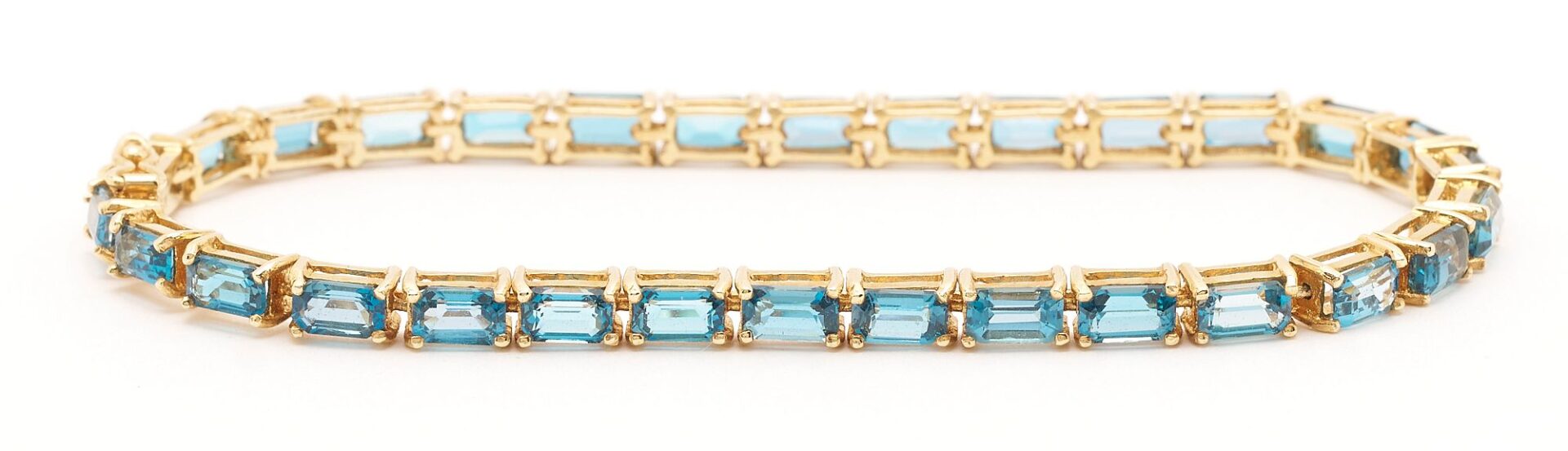 Lot 846: Gold & Blue Topaz Bracelet, Earrings, Brooch, and Pendant