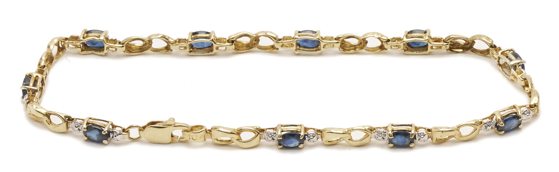 Lot 1225: Three (3) Ladies' Bracelets: 14K Yellow & White Gold Bracelet, 10K Yellow Gold & Sapphire Bracelet, and 10K White Gold & Blue Topaz