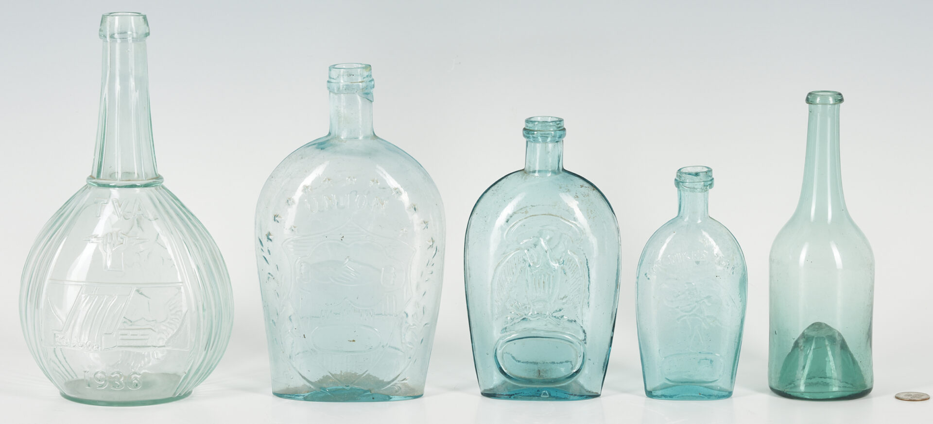 Lot 249: 4 Historical Glass Flasks plus 1 Early Glass Bottle