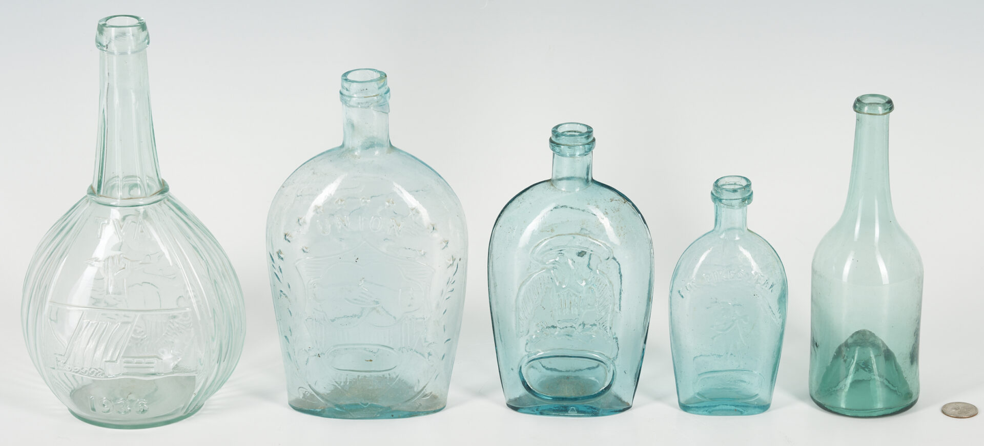 Lot 249: 4 Historical Glass Flasks plus 1 Early Glass Bottle