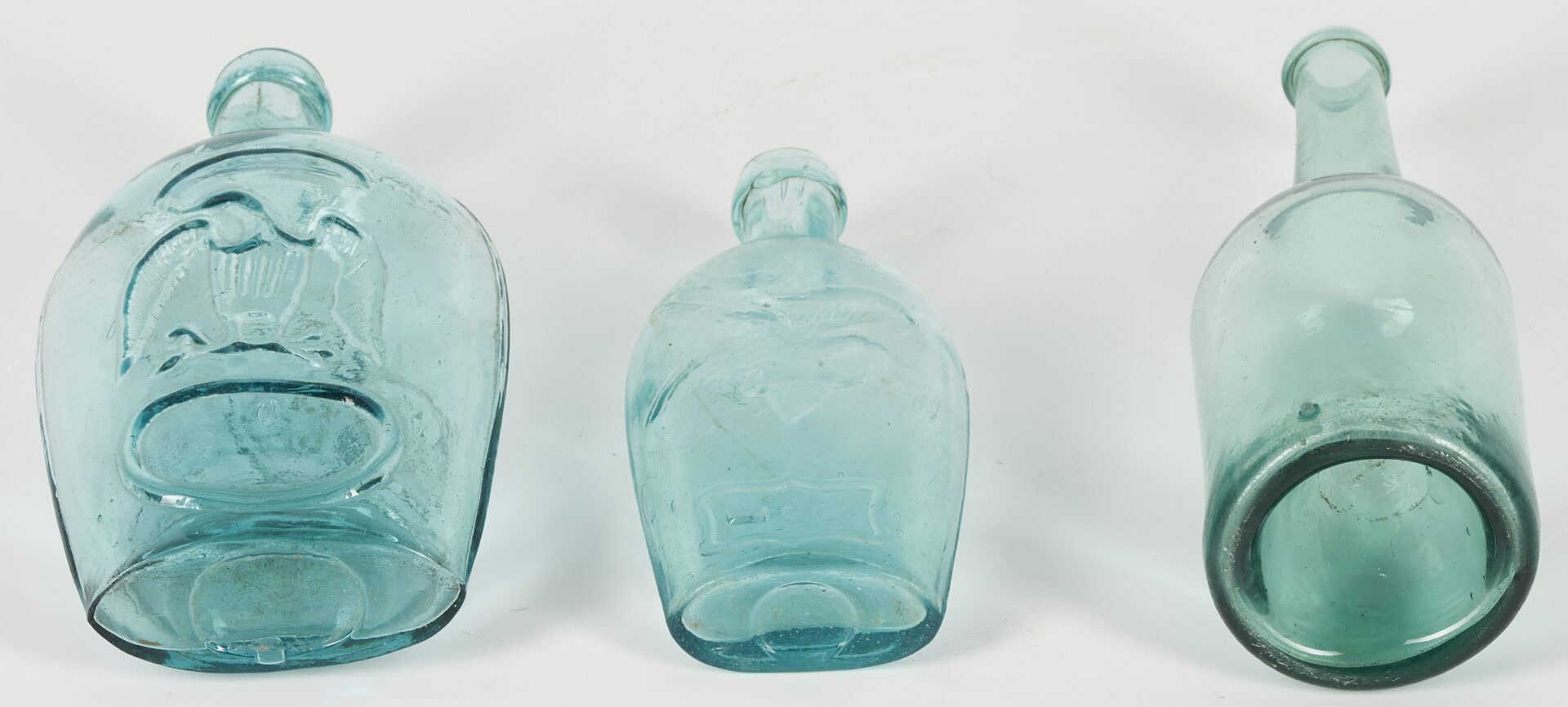 Lot 249: 4 Historical Glass Flasks plus 1 Early Glass Bottle