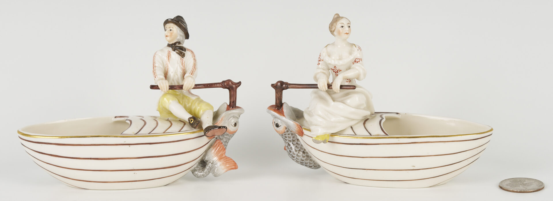 Lot 463: Polish Faience Porcelain Figure of Man with Pig, Plus Pair of Nymphenburg Salts