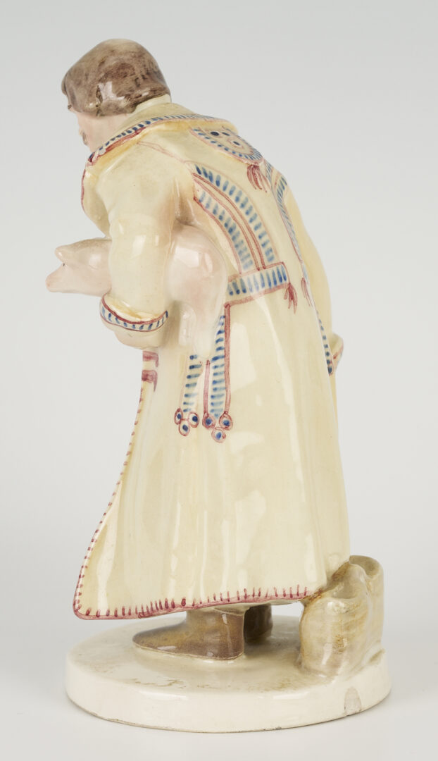 Lot 463: Polish Faience Porcelain Figure of Man with Pig, Plus Pair of Nymphenburg Salts