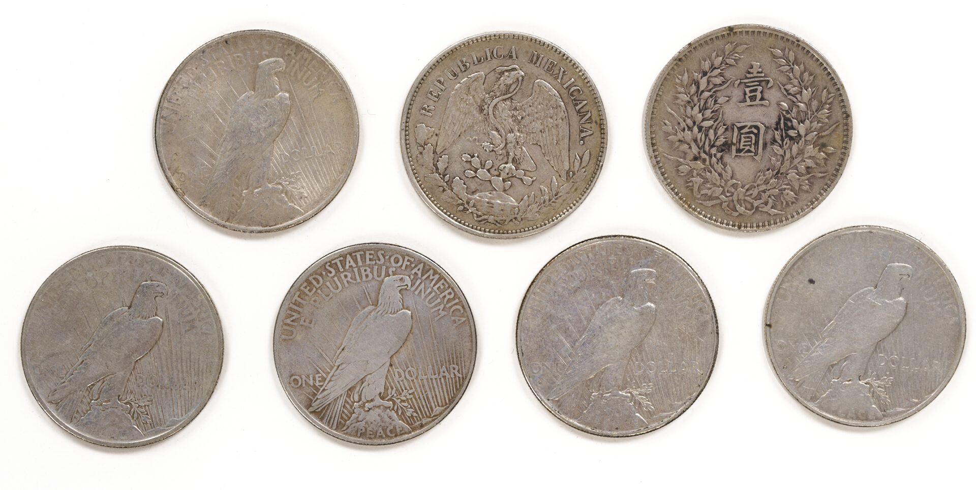 Lot 675: Group of 17 US Morgans, 5 Peace Silver Dollars, Yaun Shikai Dollar & Mexican Peso