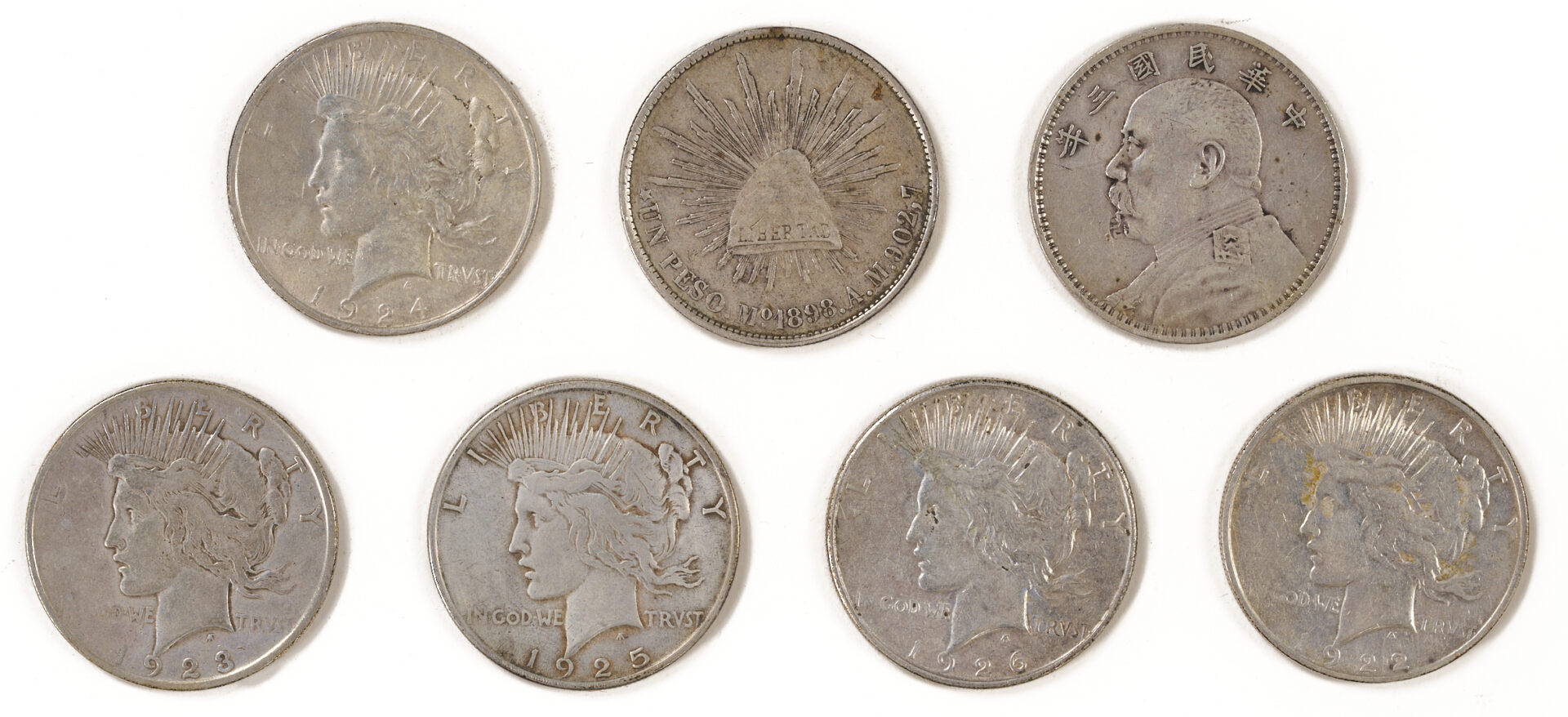 Lot 675: Group of 17 US Morgans, 5 Peace Silver Dollars, Yaun Shikai Dollar & Mexican Peso