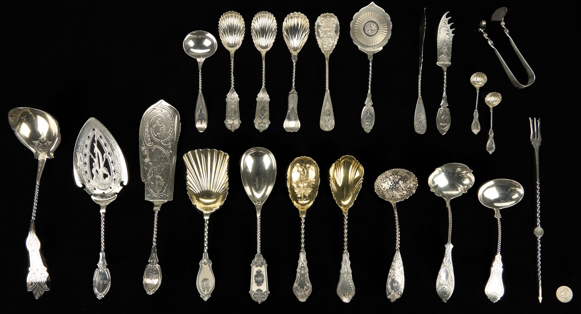 Lot 709: 22 Assorted Twist Handle Silver Serving Pieces