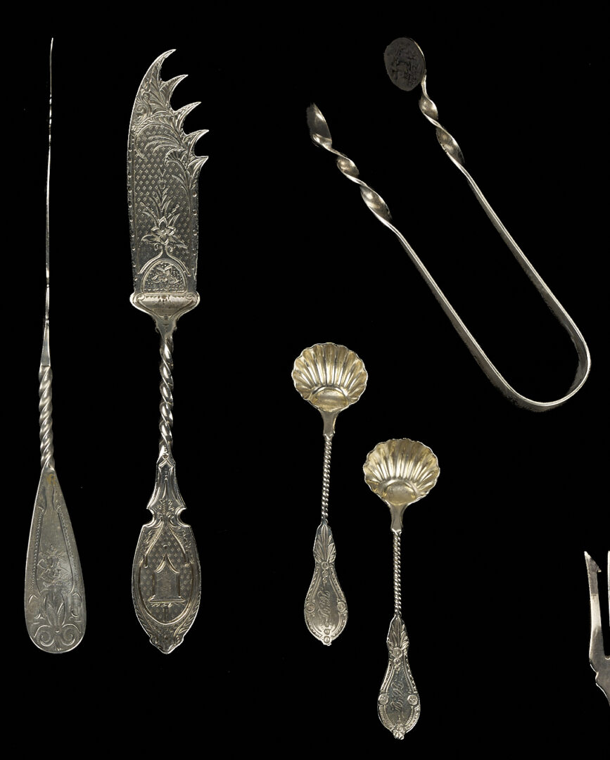 Lot 709: 22 Assorted Twist Handle Silver Serving Pieces