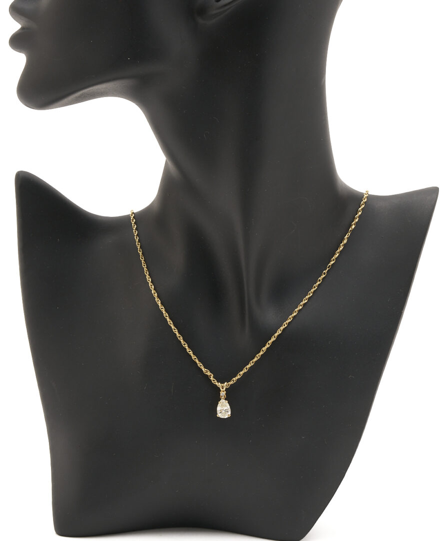 Lot 844: Lady's 14K Yellow Gold Pear Cut Diamond Pendant & Rope Chain Necklace