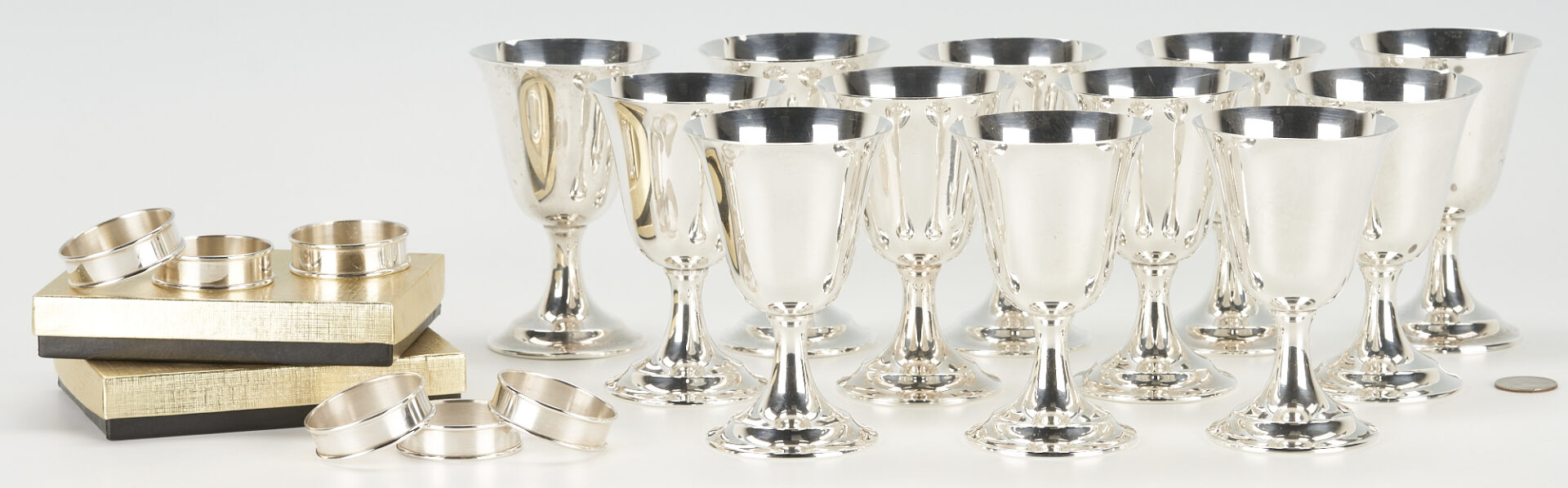 Lot 859: 12 International Sterling Wine Goblets plus 6 Napkin Rings