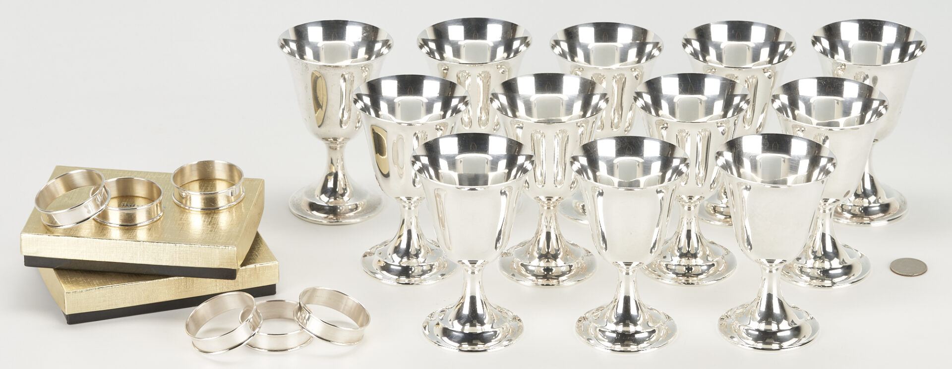 Lot 859: 12 International Sterling Wine Goblets plus 6 Napkin Rings