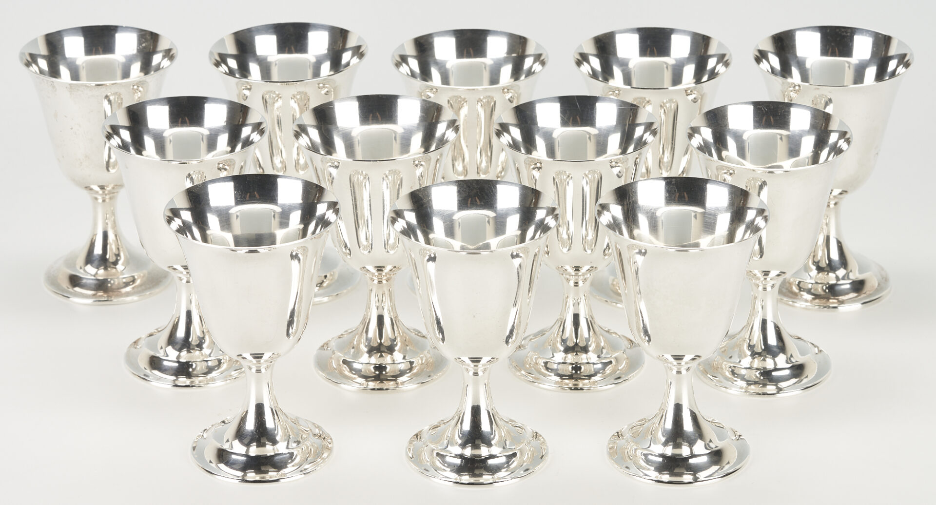 Lot 859: 12 International Sterling Wine Goblets plus 6 Napkin Rings