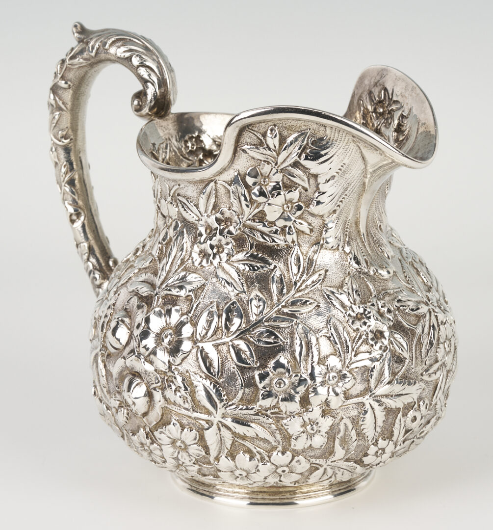 Lot 864: Kirk Sterling Silver Repousse Pitcher + 4 Serving Pieces