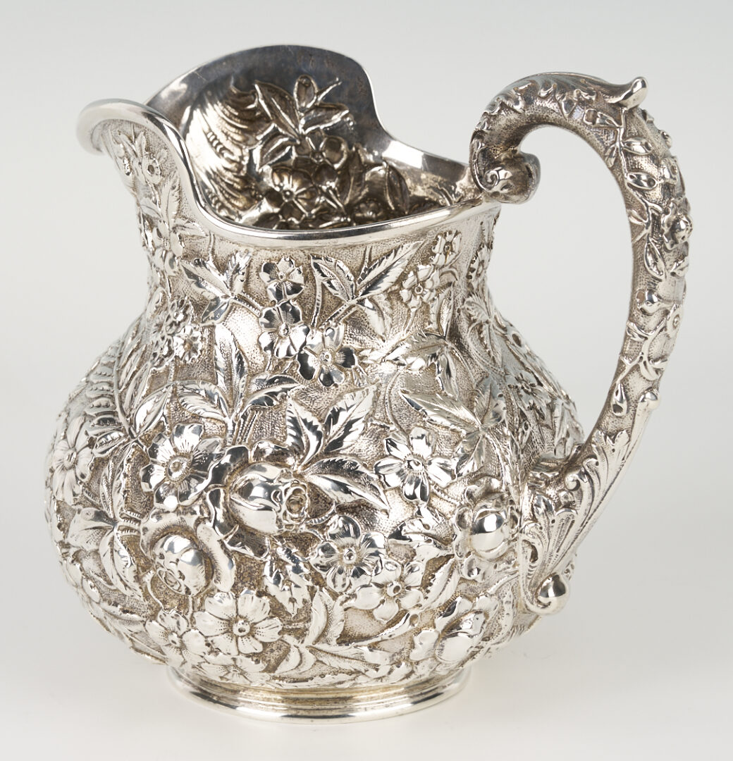 Lot 864: Kirk Sterling Silver Repousse Pitcher + 4 Serving Pieces