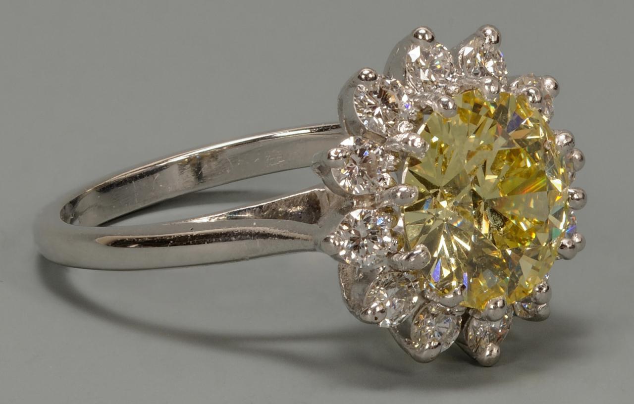 Lot 146: 2.99 ct fancy yellow diamond and platinum ring