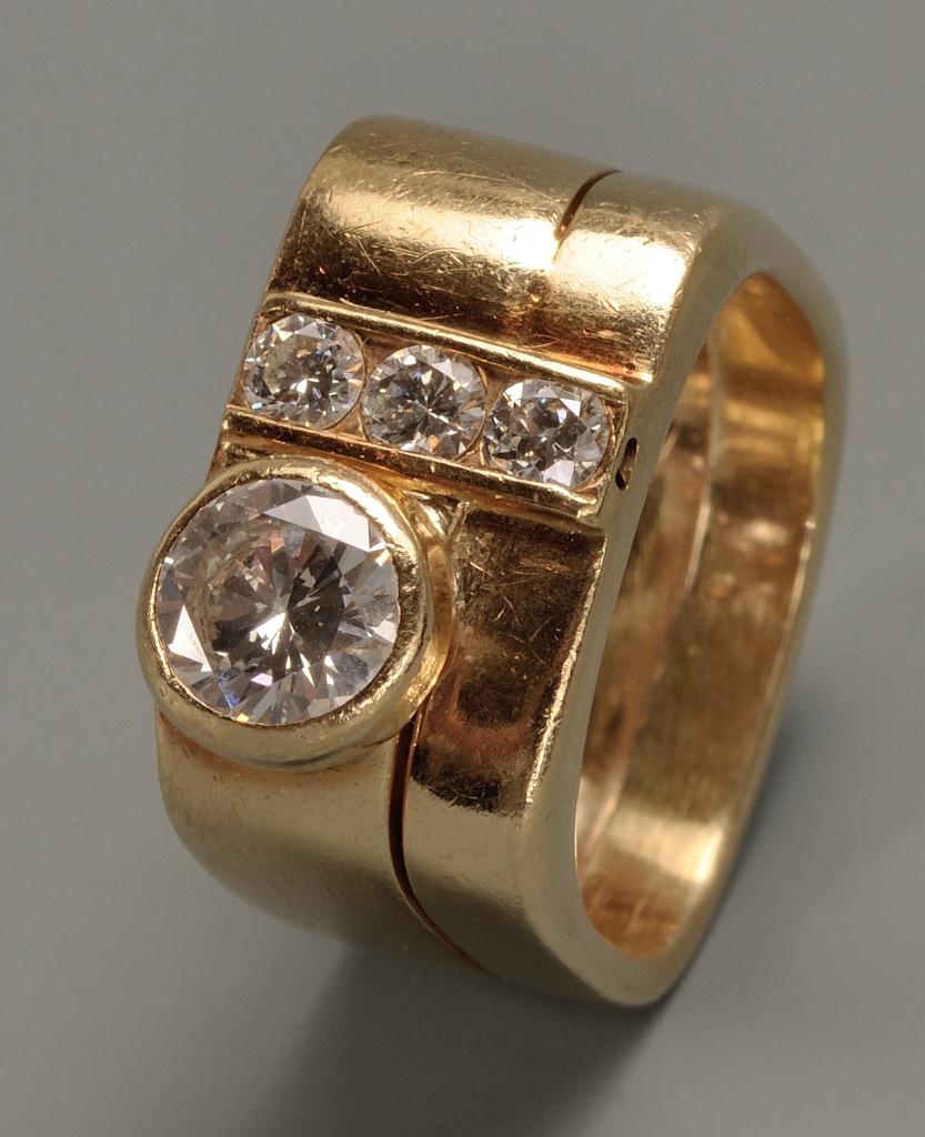 Lot 150: 14K Lady's custom diamond ring. 1.15 cts total