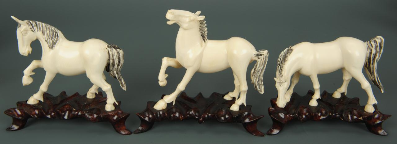 Lot 15: Eight Chinese carved ivory horses of Mu Wang