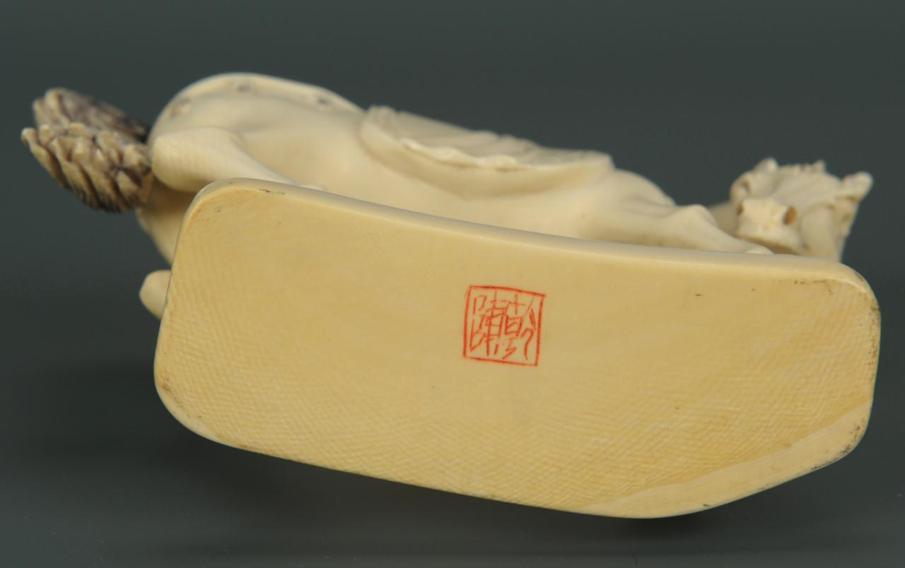 Lot 16: Finely carved ivory horse okimono