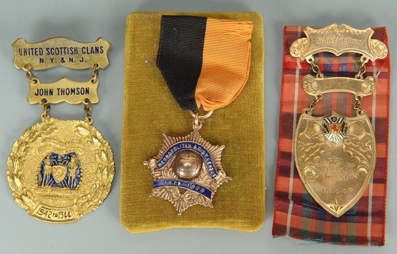 Lot 279: 3 United Scottish Clan Medals, two (2) 10K gold