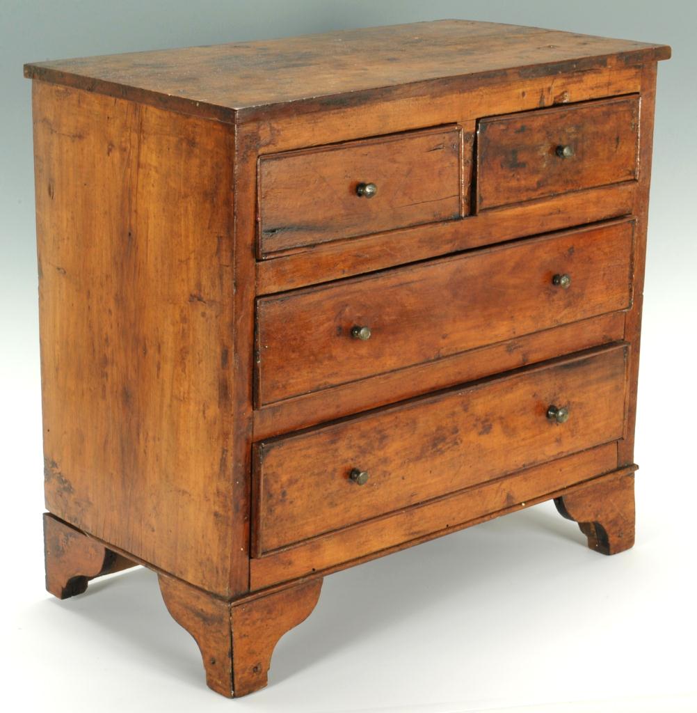Lot 288: Miniature chest of drawers