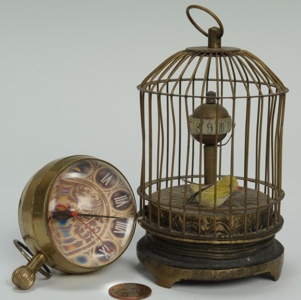 Lot 309: 2 novelty clocks: Birdcage and Paperweight
