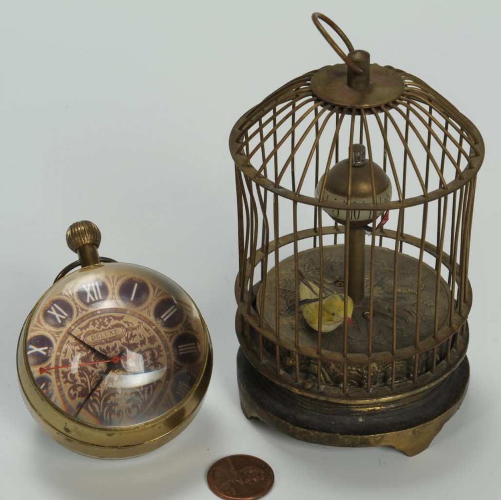 Lot 309: 2 novelty clocks: Birdcage and Paperweight