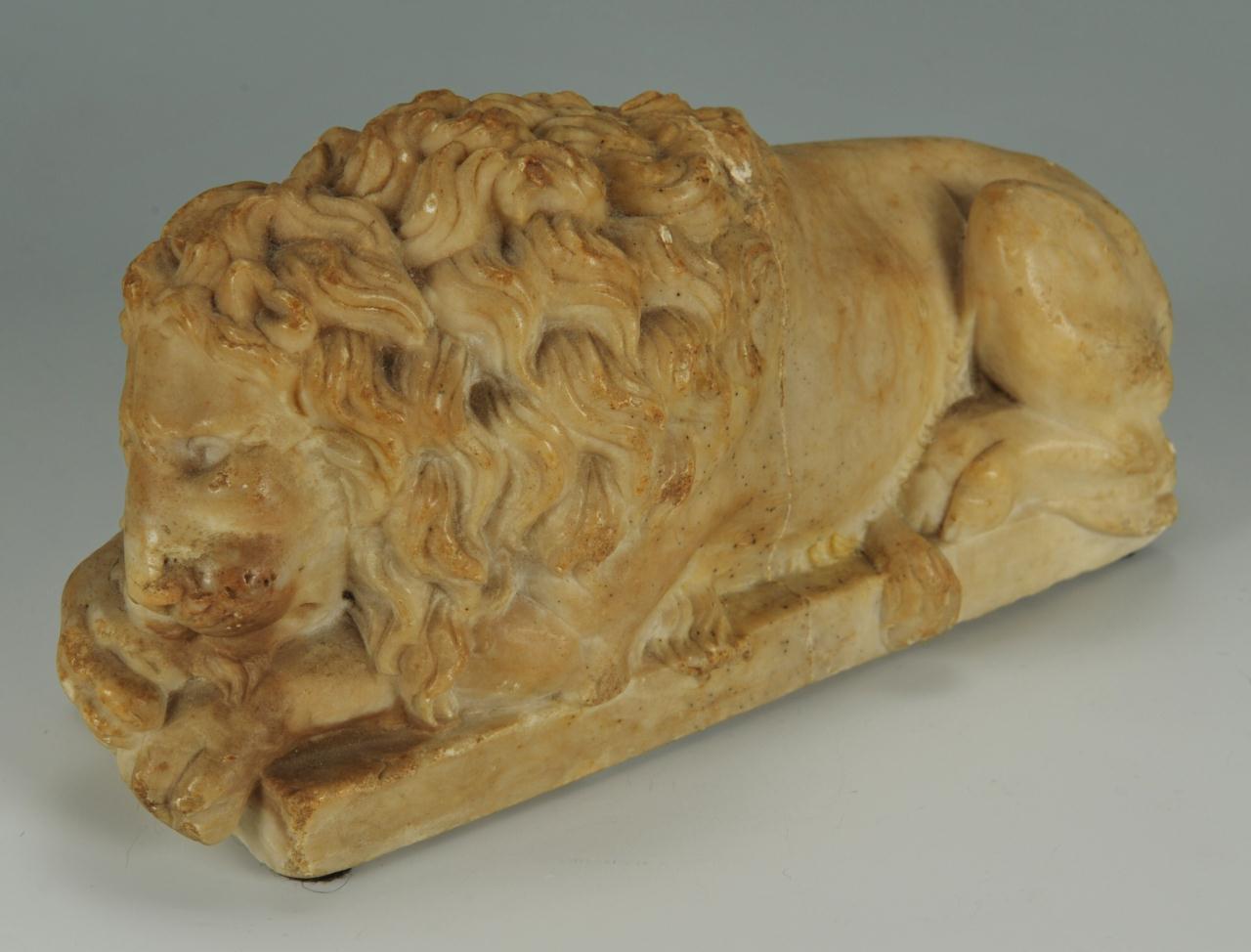 Lot 493: Pair of Marble Recumbent Lions, after Canova