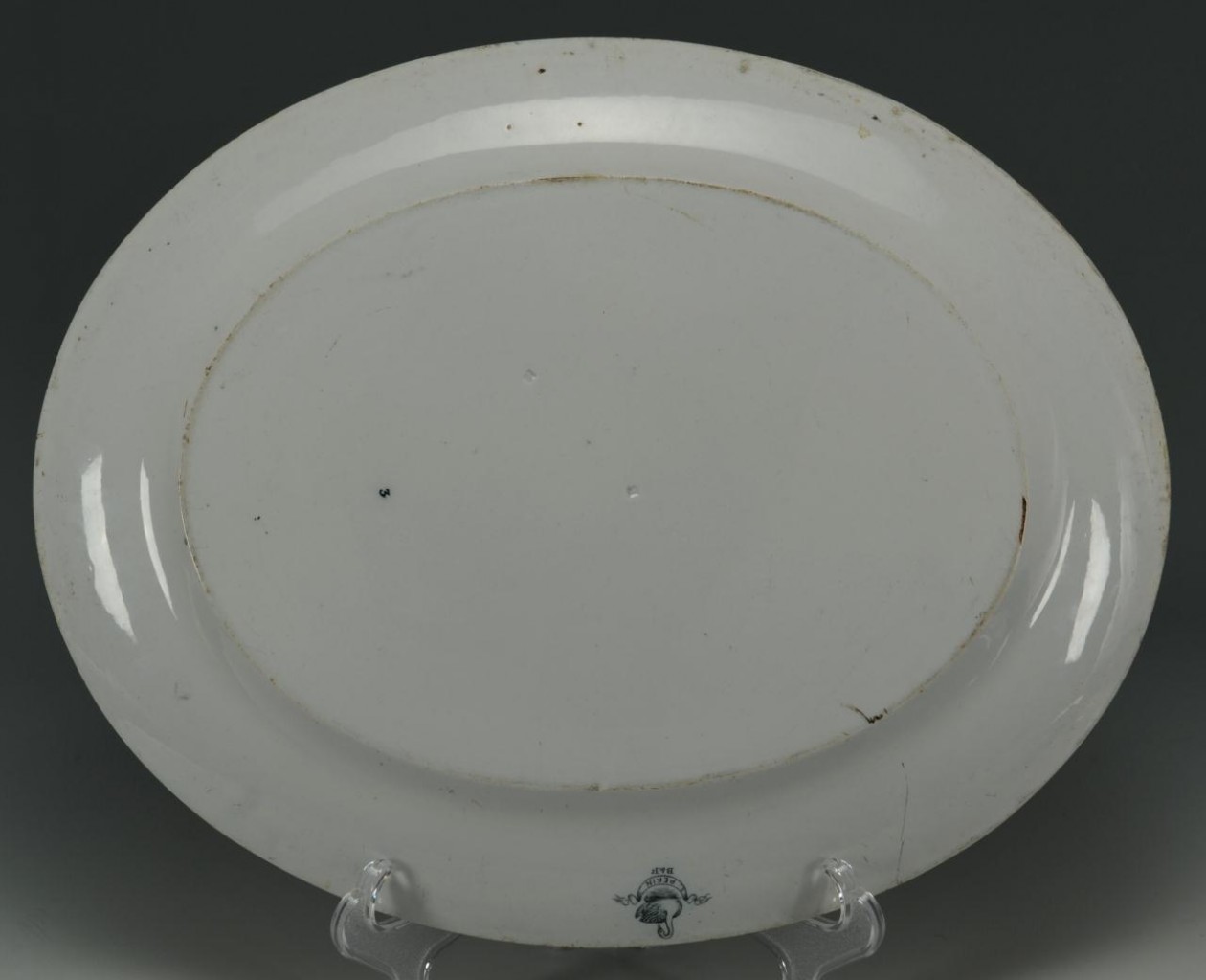 Lot 557: Two Staffordshire Platters and a Gibson Girl Plate