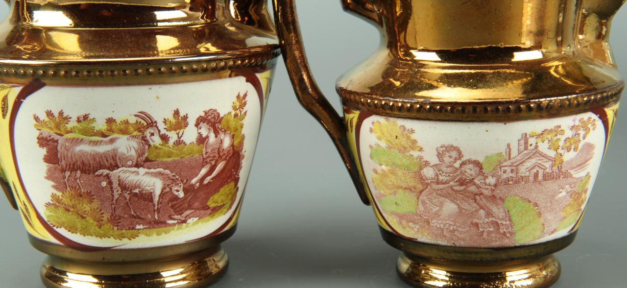 Lot 560: Four silver and copper lustre pitchers